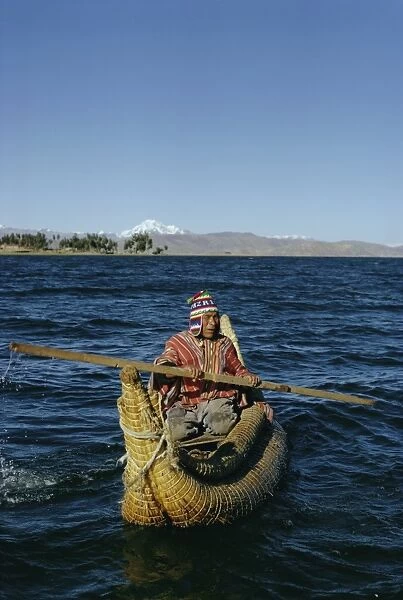 Aymara Indian in a reed boat, Lake Titicaca, Bolivia, South America