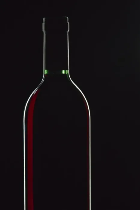Framed Print : Backlit shot of a bottle of red wine Framed Print : Backlit shot of a bottle of red wine