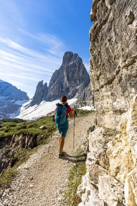 Framed Print : Backpacker woman with hiking poles enjoying the view to Croda Dei Toni from path Framed Print : Backpacker woman with hiking poles enjoying the view to Croda Dei Toni from path