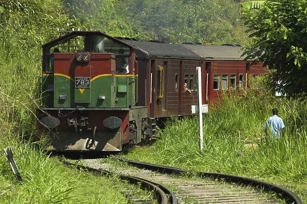 The Badulla to Colombo train, a scenic ride through the Central Highlands with its mountains