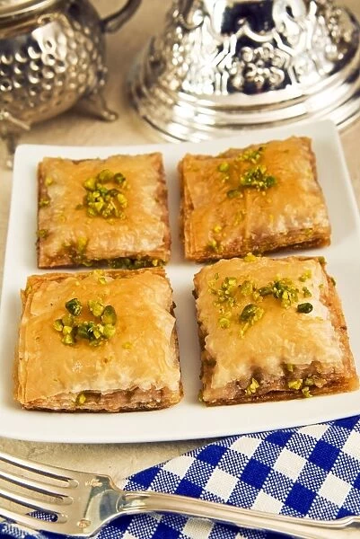 Baklava, sweet pastry made of layers of filo pastry filled with chopped nuts