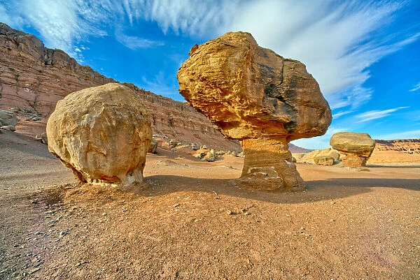 Balanced boulders at the base of Vermilion Cliffs in Glen Canyon Recreation Area, Arizona