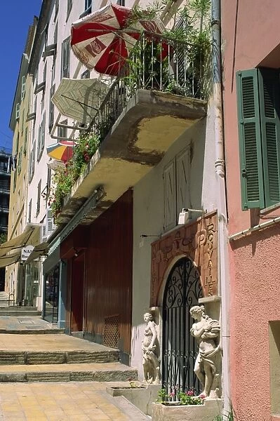 Balcony and house entrance in the ancient town, Ajaccio, island of Corsica