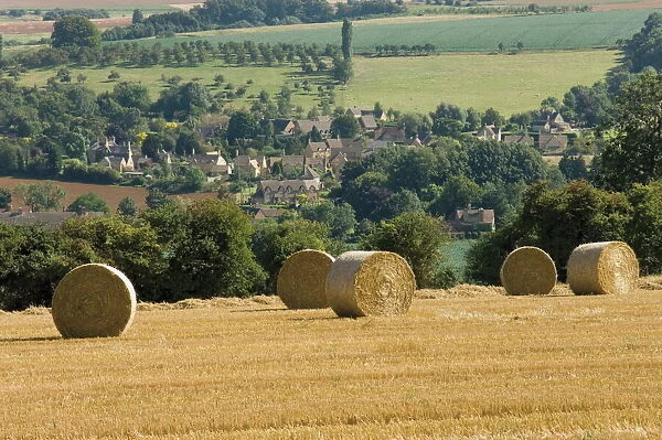 Bales of hay with Chipping Campden beyond, from the Cotswolds Way footpath