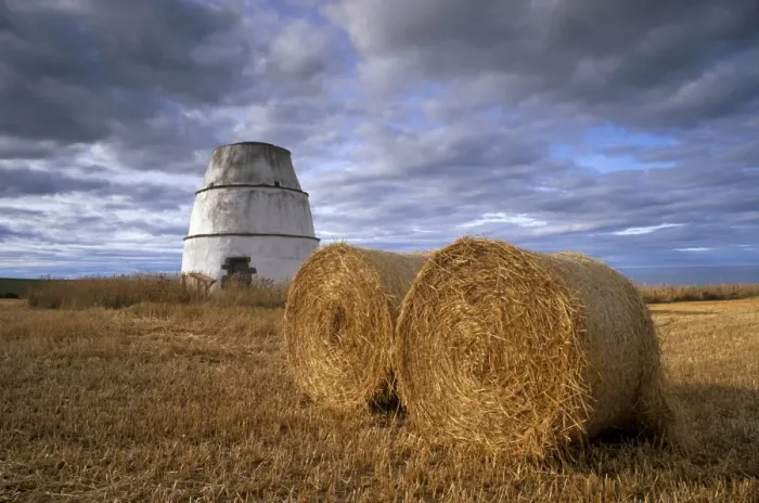 Framed Print : Bales of straw and old dovecote Framed Print : Bales of straw and old dovecote