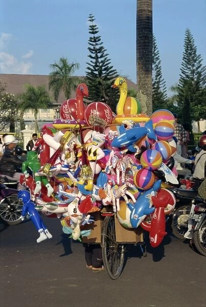 Balloon seller on bicycle
