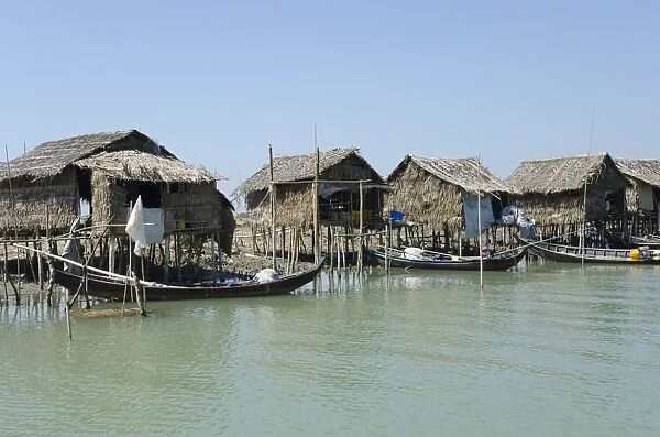Bamboo huts and boats along a waterway, Irrawaddy delta, Myanmar (Burma), Asia