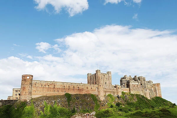 Bamburgh Castle, a fortress constructed on top of a craggy outcrop of volcanic dolerite in the Middle Ages, now a Grade I Listed Building, Bamburgh, Northumberland, England, United Kingdom, Europe