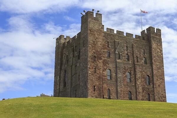 Bamburgh Castle, The Keep, with English flag of St. George, Bamburgh, Northumberland