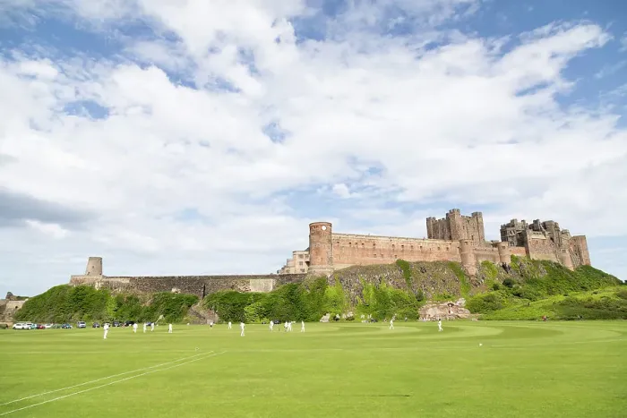 Framed Print : Bamburgh Castle, a medieval fortress, Grade I Listed Building constructed on top of a craggy outcrop of volcanic dolerite, overlooking a cricket ground, Bamburgh, Northumberland, England, United Kingdom, Europe Framed Print : Bamburgh Castle, a medieval fortress, Grade I Listed Building constructed on top of a craggy outcrop of volcanic dolerite, overlooking a cricket ground, Bamburgh, Northumberland, England, United Kingdom, Europe