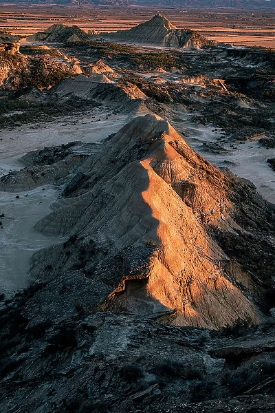 Bardenas Reales rock formation in the badlands, illuminated with the last sunset light, Navarre, Spain, Europe