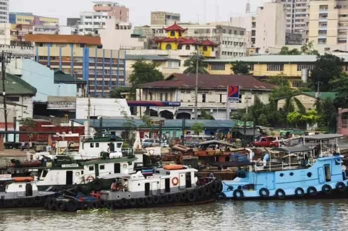 Framed Print : Barges on River Pasig with city buildings behind Framed Print : Barges on River Pasig with city buildings behind