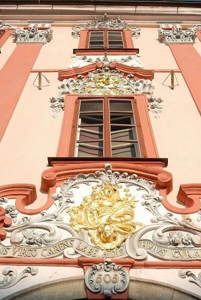 Detail of Baroque decoration on facade of building, Kral Jiri z Podebrad Square