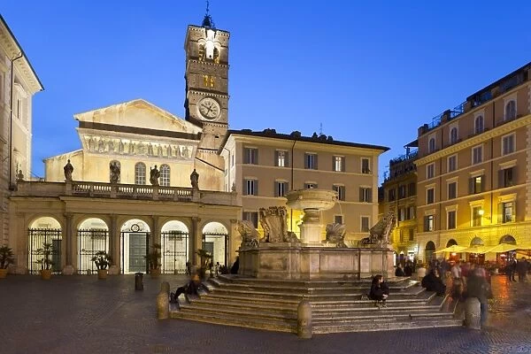 Baroque fountain and Santa Maria in Trastevere at night, Piazza Santa Maria in Trastevere