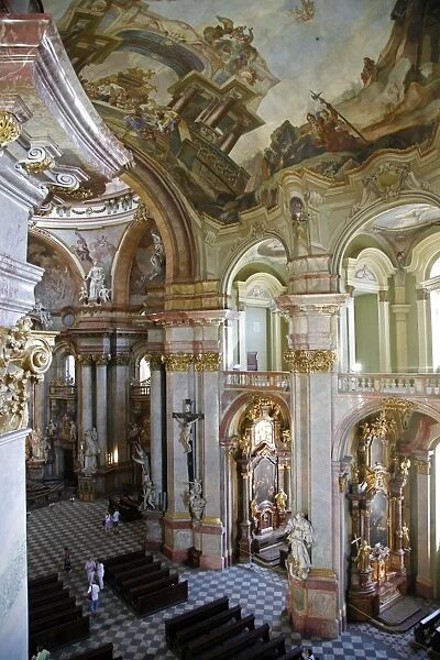 The Baroque interior of St. Nicholas Church in Mala Strana, Prague, Czech Republic
