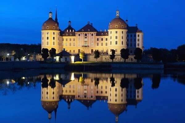 Baroque Moritzburg Castle and reflections in lake at twilight, Moritzburg