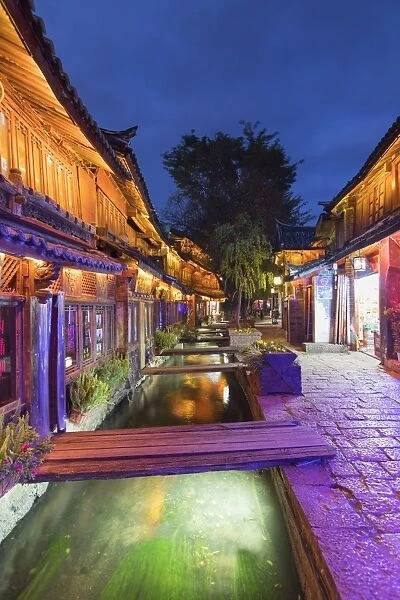 Bars and restaurants along canal at dusk, Lijiang, UNESCO World Heritage Site, Yunnan