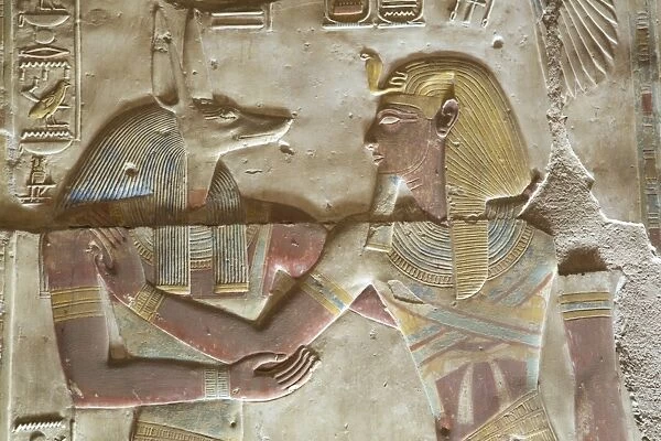 Bas-relief of the God Anubis on left, with the Pharaoh Seti I, Temple of Seti I, Abydos