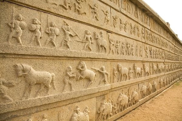 Bas relief scenes from life in the Vijayanagar Empire on the Mahanavami Dibba within the royal enclosure at Hampi, UNESCO World Heritage Site, Karnataka