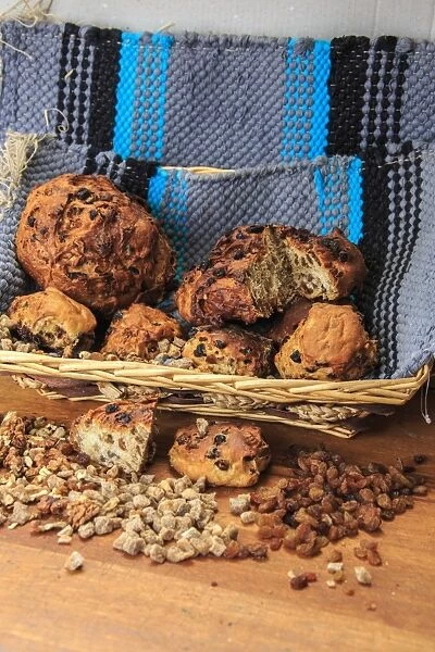 Basket of Bisciola, typical Italian bread made with walnuts, raisins and figs from Valtellina, Lombardy, Italy, Europe