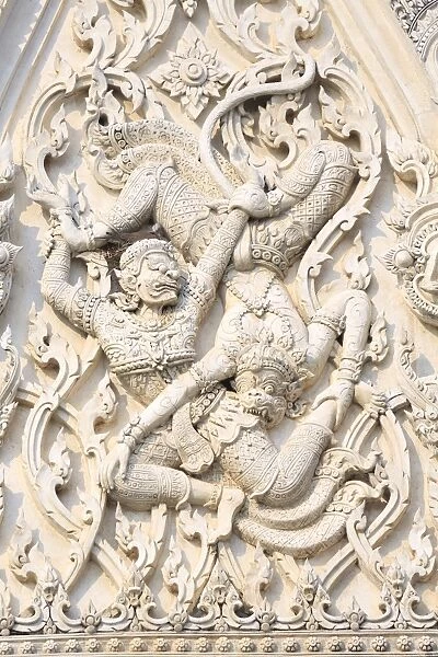 Detail of battling demons on Khmer style Wat Mahathat Worawihan temple in Phetchaburi, Thailand, Southeast Asia, Asia