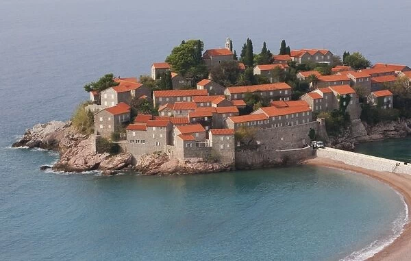 Beach and houses on the hotel island at Sveti Stefan on the Adriatic coast