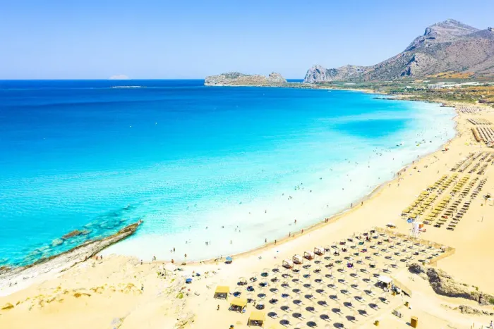 Framed Print : Beach umbrellas and sunbeds on white sand of Falassarna beach overlooking the crystal sea Framed Print : Beach umbrellas and sunbeds on white sand of Falassarna beach overlooking the crystal sea