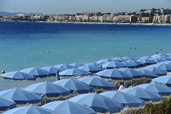 Beach umbrellas viewed from the Promenade des Anglais, Nice, Alpes Maritimes