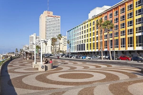 Beachfront promenade in front of the colourfully decorated hotel facades, Tel Aviv, Israel, Middle East