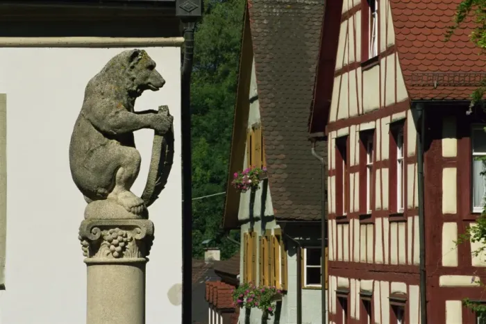 Framed Print : Bear Fountain and timbered house Framed Print : Bear Fountain and timbered house