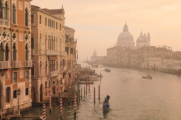 Beautiful Grand Canal, winter fog, morning golden light, Santa Maria della Salute, Venice