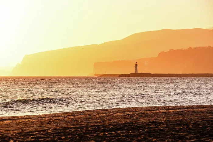 Framed Print : Beautiful orange hazy sunset in Almeria, Andalusia, Spain. Seascape hills of the Sierra Nevada on the shore with a light house Framed Print : Beautiful orange hazy sunset in Almeria, Andalusia, Spain. Seascape hills of the Sierra Nevada on the shore with a light house