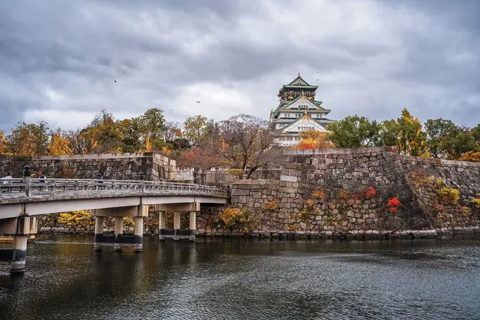 Framed Print : Beautiful Osaka Castle moat in autumn (fall) with bridge leading over the waters towards the Samurai Castle, Osaka, Honshu, Japan, Asia Framed Print : Beautiful Osaka Castle moat in autumn (fall) with bridge leading over the waters towards the Samurai Castle, Osaka, Honshu, Japan, Asia