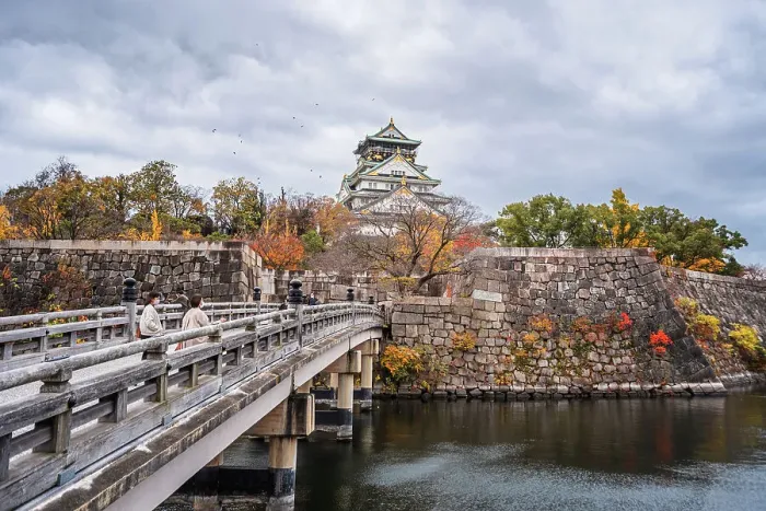 Framed Print : Beautiful Osaka Castle moat in autumn (fall) with bridge leading over the waters towards the Samurai Castle, Osaka, Honshu, Japan, Asia Framed Print : Beautiful Osaka Castle moat in autumn (fall) with bridge leading over the waters towards the Samurai Castle, Osaka, Honshu, Japan, Asia