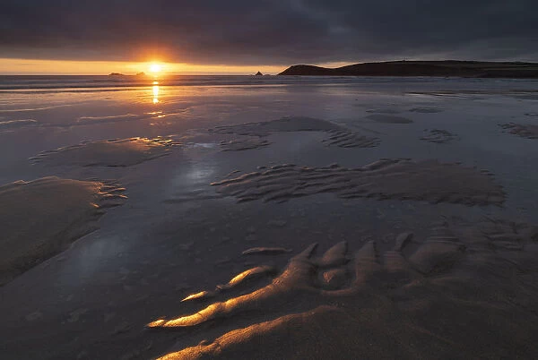 Beautiful sunset light over the beach at Constantine Bay in North Cornwall, England