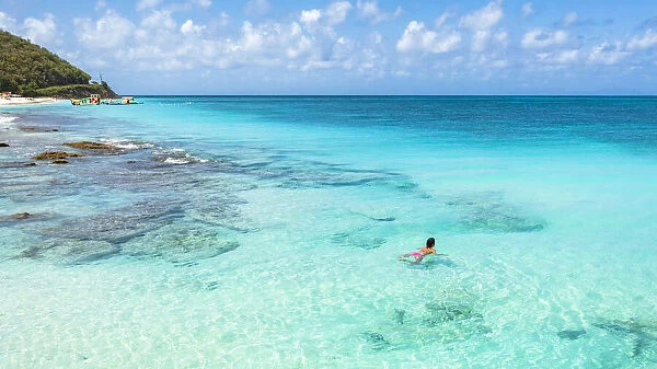 Beautiful woman enjoying swimming in the crystal Caribbean Sea, Antigua, Antigua and Barbuda, Leeward Islands, West Indies, Caribbean, Central America