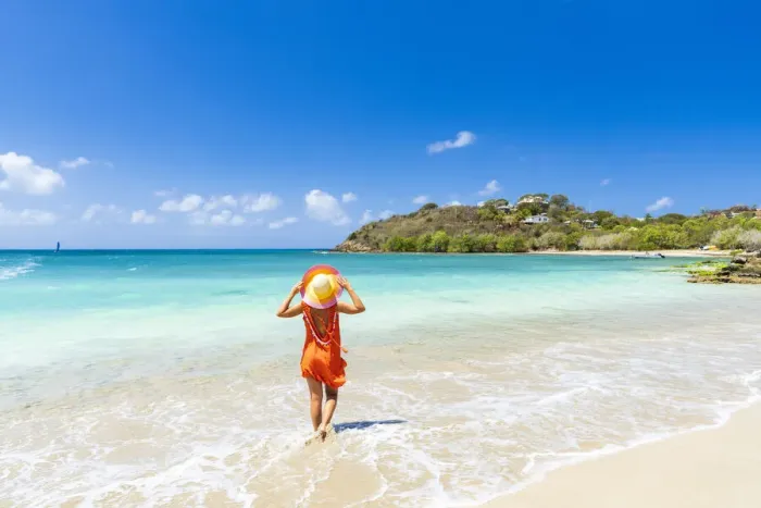 Framed Print : Beautiful woman with orange dress and straw hat standing on a tropical beach, Antigua, West Indies, Caribbean, Central America Framed Print : Beautiful woman with orange dress and straw hat standing on a tropical beach, Antigua, West Indies, Caribbean, Central America
