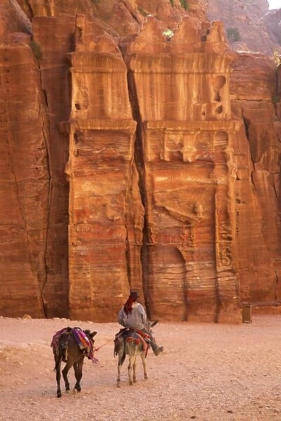 Bedouin riding donkey in the Siq, Petra, UNESCO World Heritage Site, Jordan, Middle East