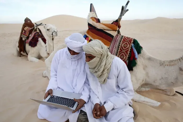 Framed Print : Bedouins using a laptop in the Sahara, Douz, Kebili, Tunisia, North Africa, Africa