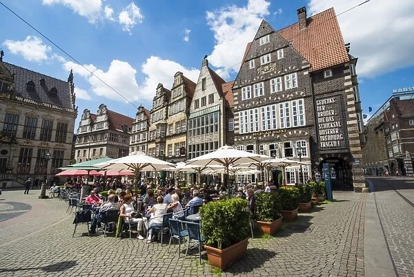 Beer garden in front of old Hanse houses on the market square of Bremen, Germany, Europe