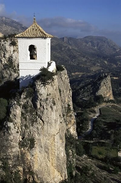 Bell tower in village built on steep limestone crag