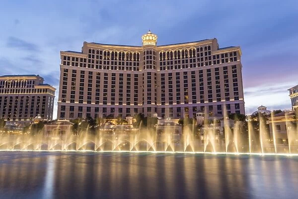 Bellagio at dusk with fountains, The Strip, Las Vegas, Nevada, United States of America, North America