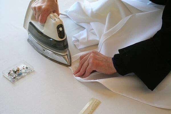 Benedictine nun making religious vestment, Urt, Pyrenees Atlantique, France, Europe