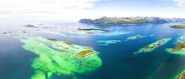 Bergsoyan Islands surrounded by emerald transparent sea in summer, Hamn I Senja, Skaland