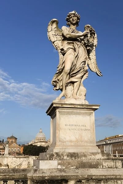 Berninis breezy maniac angels statue on the Ponte Sant Angelo with St. Peters Basilica behind