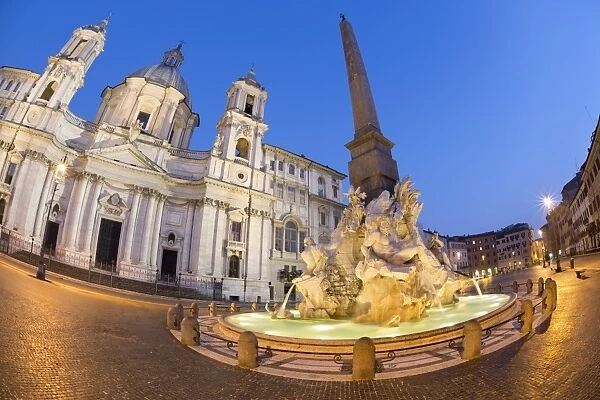 Berninis Fountain of the Four Rivers and church of Sant Agnese in Agone at night