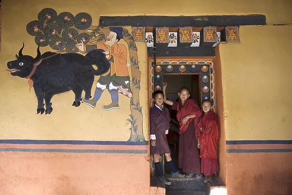Bhutanese boy and monks, Paro Dzong, Paro, Bhutan, Asia