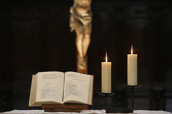 Bible and altar candles, Vienne, Isere, France, Europe