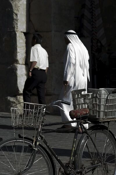 Bicycle and Arab man