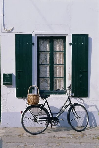 Bicycle leaning against a wall, Ile de Re, France, Europe